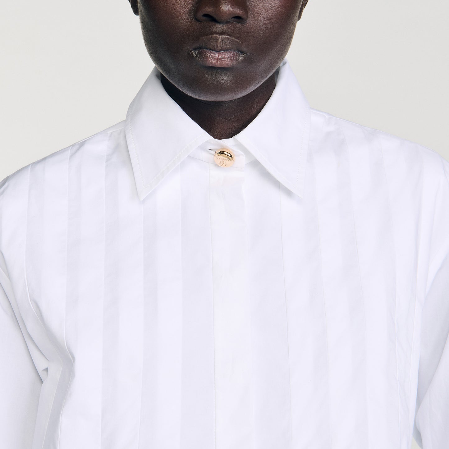 Camisa corta con pliegues
