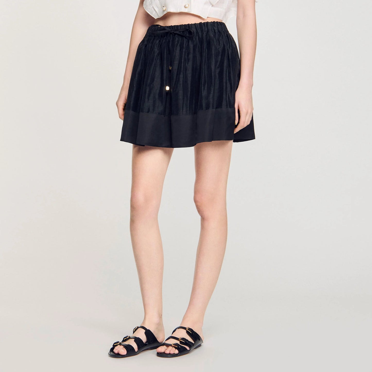 Falda corta bimaterial