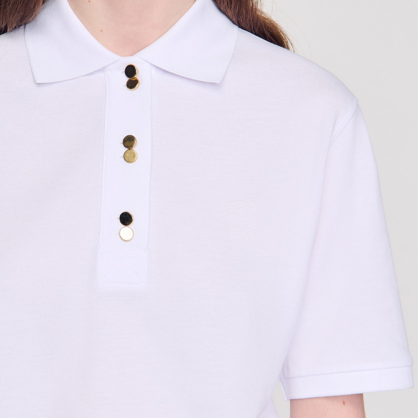 Polo con botones de fantasía