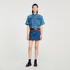 Falda corta de denim y cuero