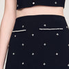 Falda corta punto bordado y strass