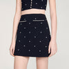 Falda corta punto bordado y strass