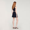 Falda corta punto bordado y strass