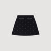 Falda corta punto bordado y strass