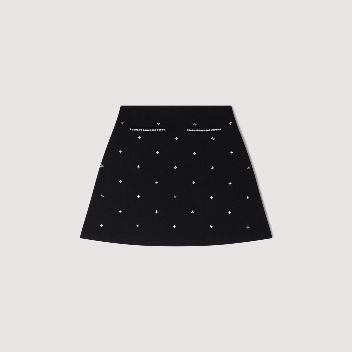 Falda corta punto bordado y strass