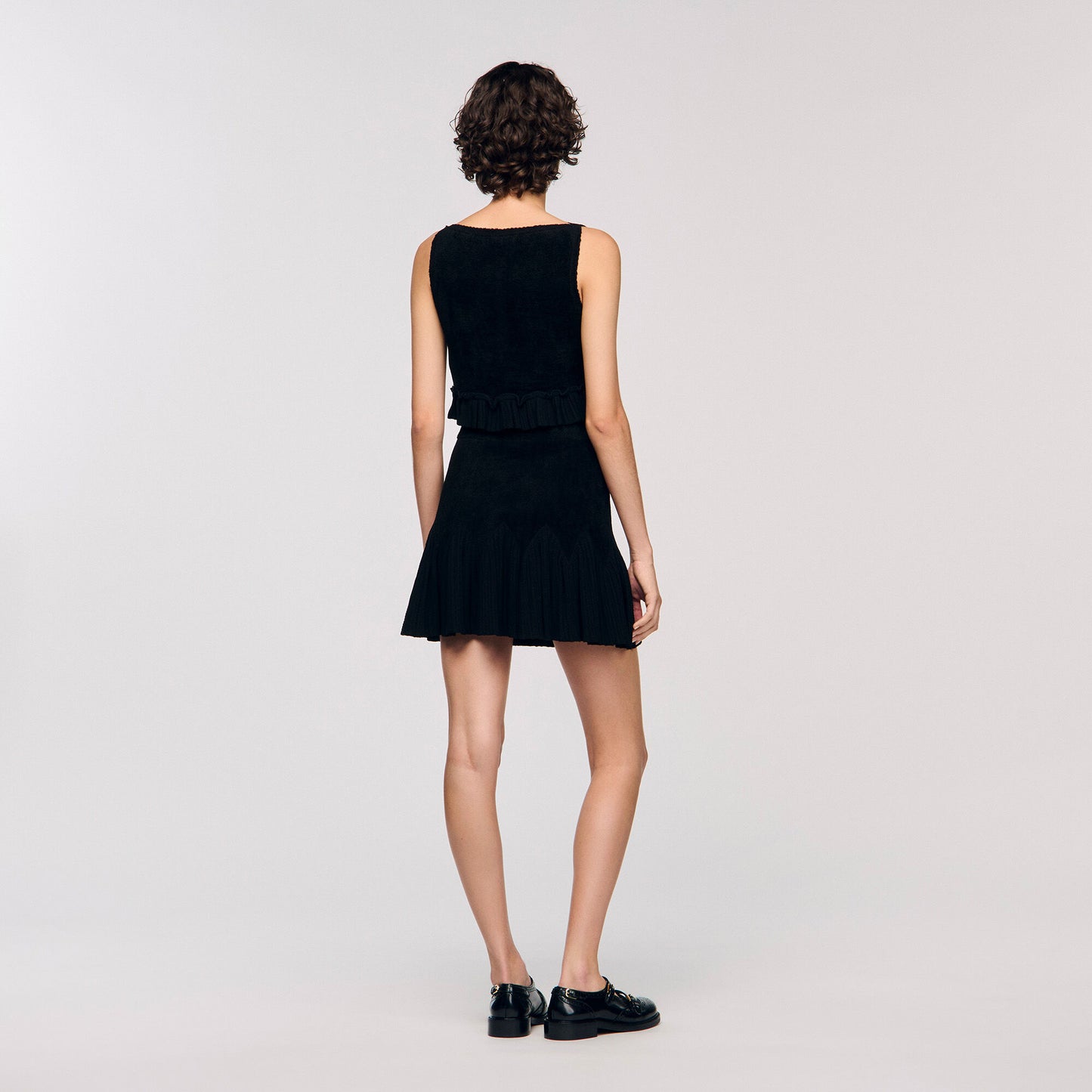 Top corto de punto con volante