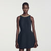 Vestido corto con detalle joya