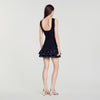 Vestido corto de punto con tachas