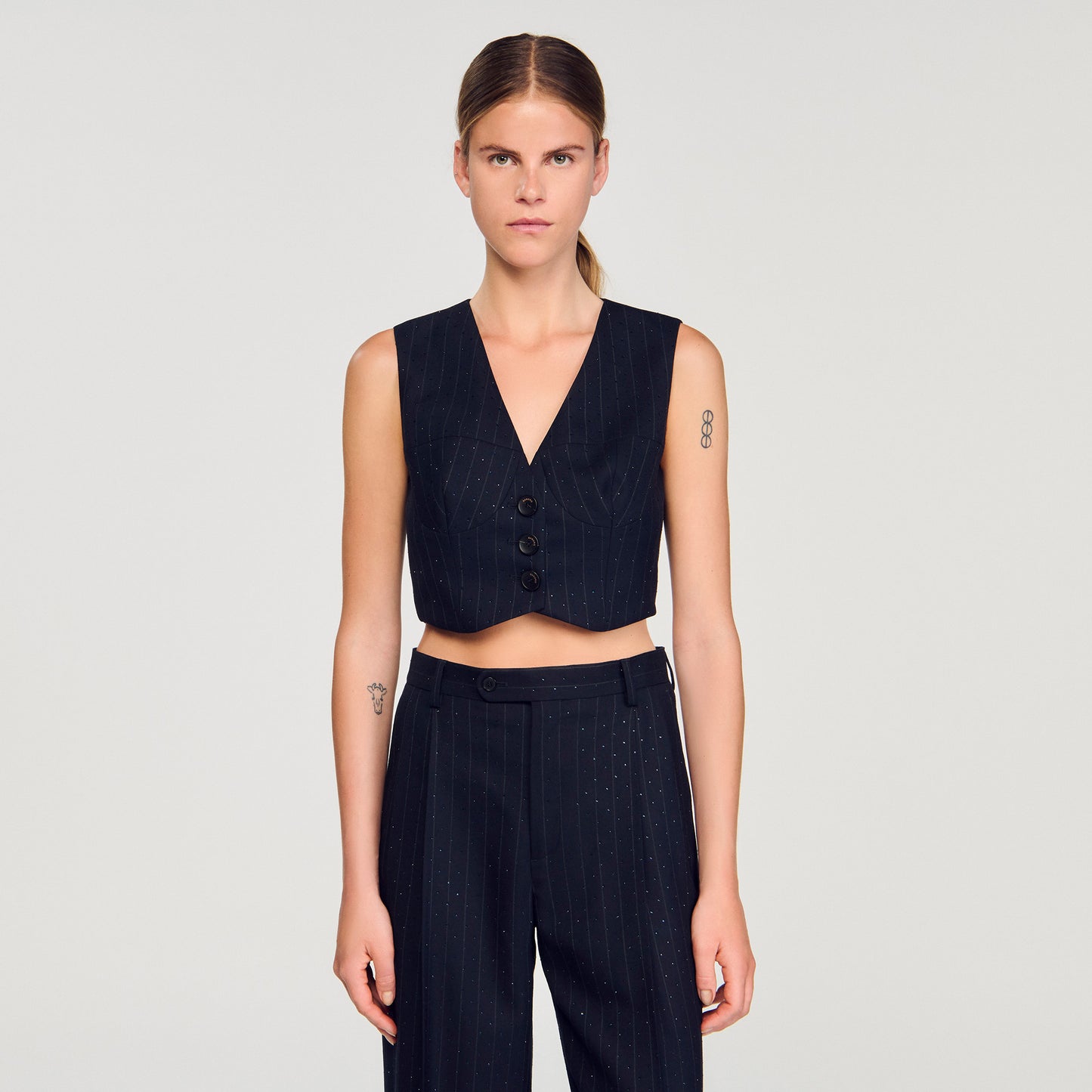 Chaleco a rayas con strass
