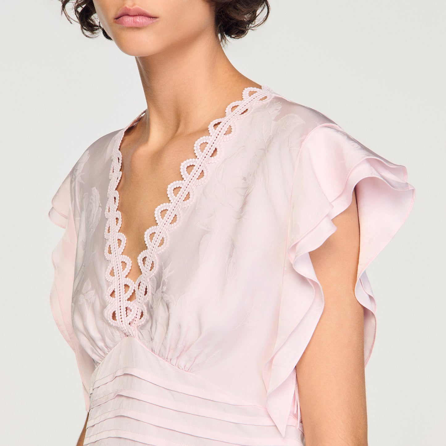 Top corto con jacquard de flores