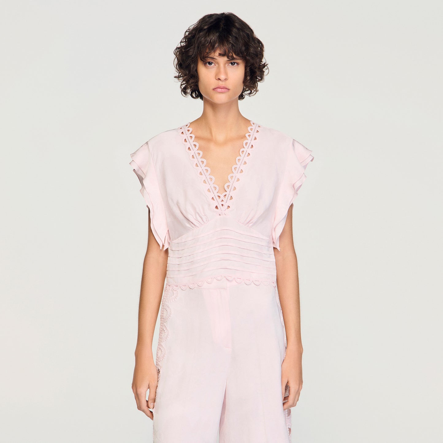 Top corto con jacquard de flores