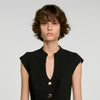 Top peplum abotonado