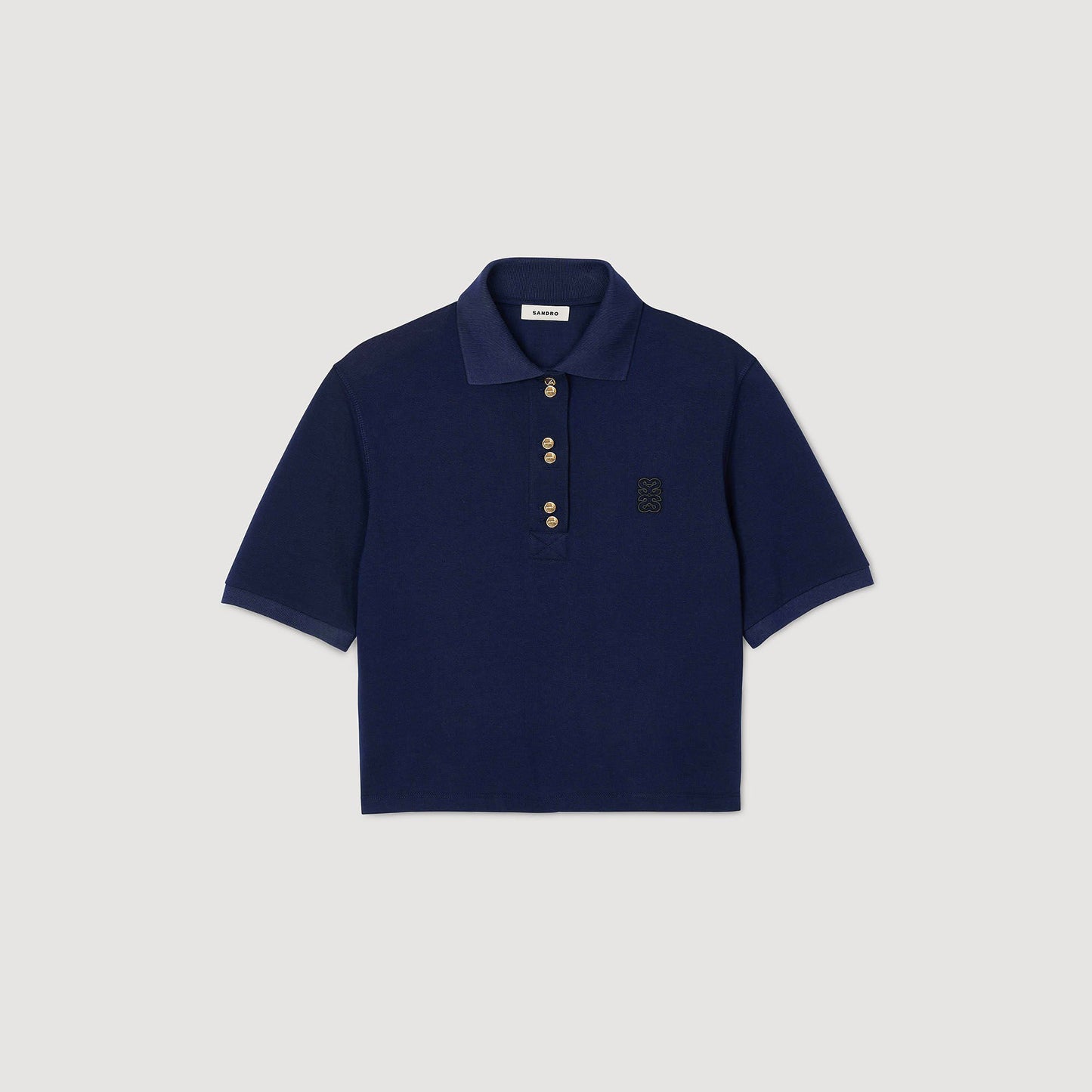 Polo con botones de fantasía