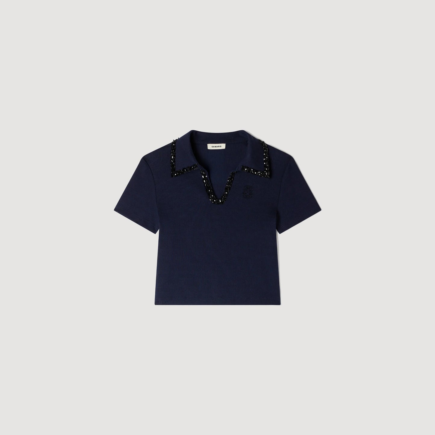 Polo con cuello de pedrería