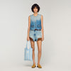 Chaleco corto denim con tachuelas