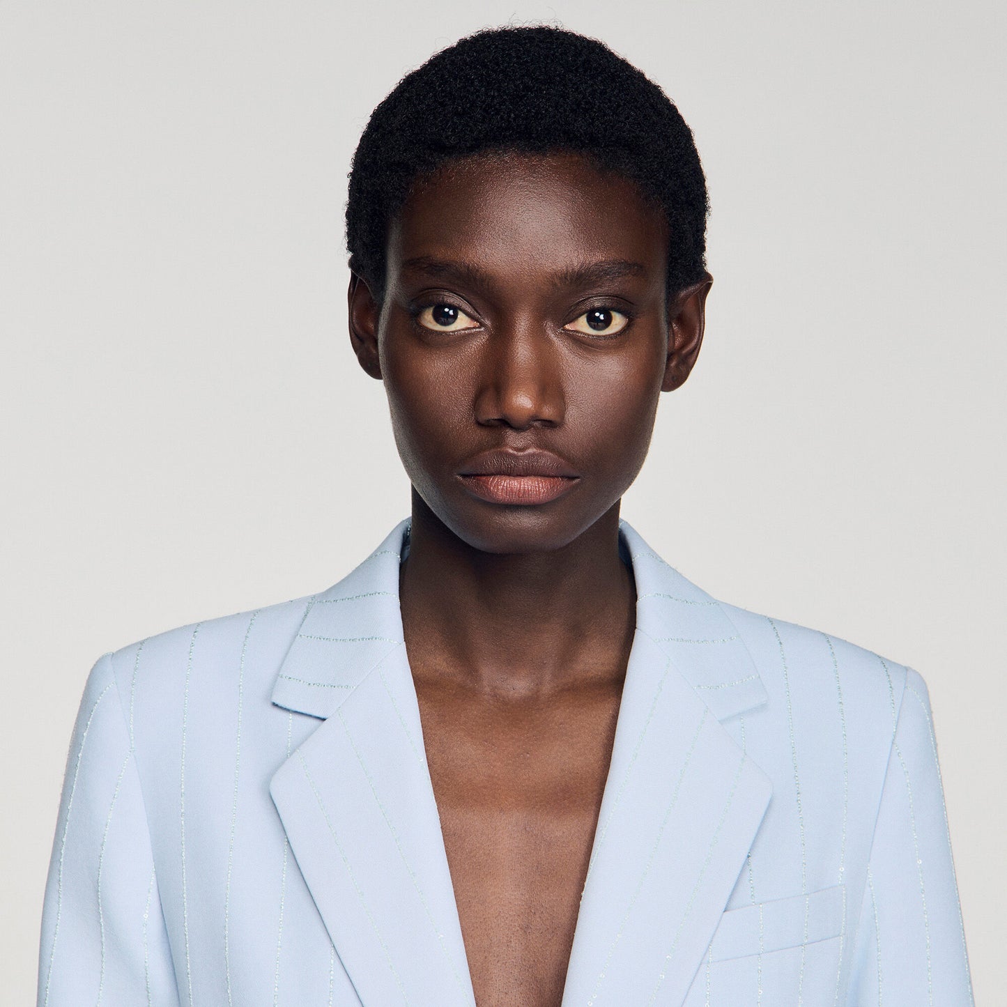 Americana con rayas de lentejuelas