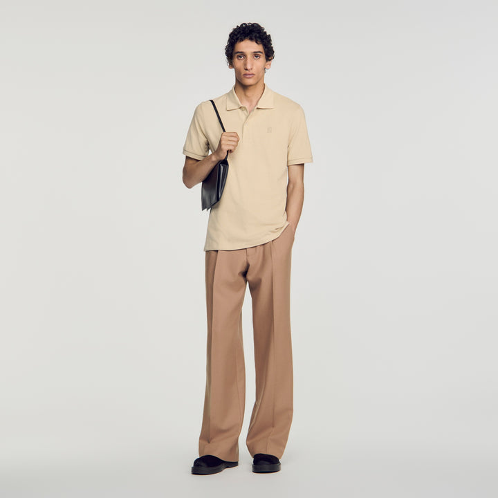 Polo de algodón con logo de cuero